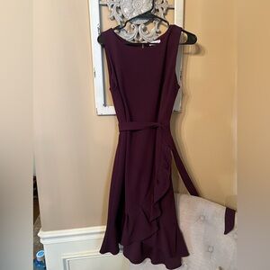 Size 12 Calvin Klein Plum sleeveless dress with flutter hem detail